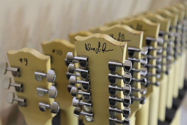 Alex Lifeson of RUSH signing guitars at the Gibson Custom Shop
