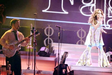 Jennifer Lopez and Guitarist Angel Fernandez playing a Gibson Les Paul Jennifer Lopez and Guitarist Angel Fernandez playing a Gibson Les Paul