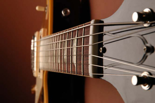The Frets: If the frets are not level and properly crowned, the guitar can sound out of tune. In extreme cases, a fretted note will actually sound at an adjacent, higher fret.